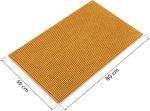 Tapis de bain teinte moutarde