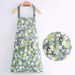 Tablier coton imperméable motif floral blanc sur vert